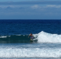 Surfer at Holoholokai beach